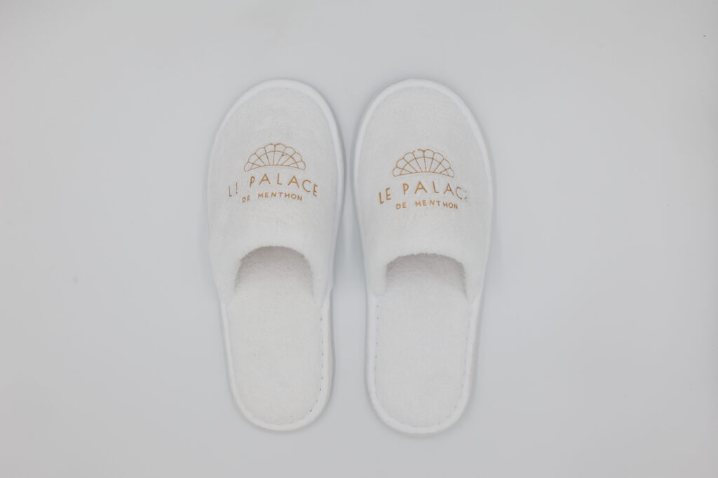 white hotel slippers